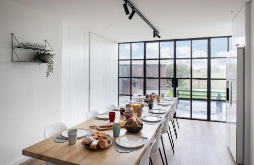 Westende House | Belcoast Guesthouse: Oceanfront Comfort with Pool Access
