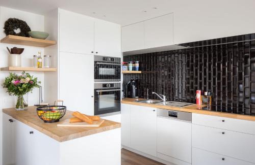 Westende House | Belcoast Guesthouse: Oceanfront Comfort with Pool Access