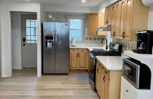 Kingsville Cottage | Bella Vista - Cedar Island: Lakefront Oasis with Spa & Pool