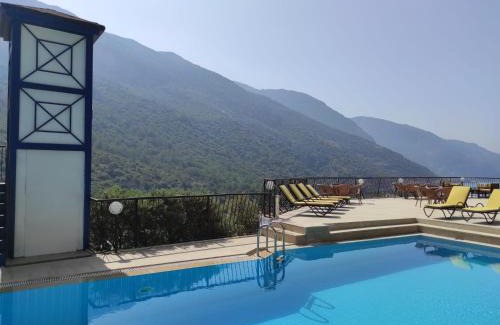Oludeniz City Center Hotel | Relaxing Belle Vue Ölüdeniz: Oceanfront Retreat with Pool