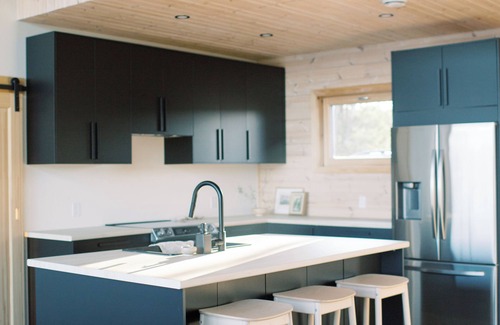 North Frontenac Cottage | Bellevue: A cozy, Scandinavian-style cottage nestled on a hill.