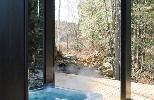 North Frontenac Cottage | Bellevue: A cozy, Scandinavian-style cottage nestled on a hill.
