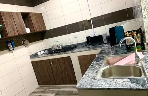 Uyo Apartment | Explore Bengys Suites: Family-Friendly with Pool Access