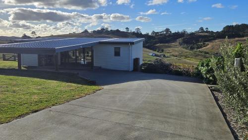 Waitoki House | Experience Comfort at Bever Farm: Pet & Child Friendly Stay