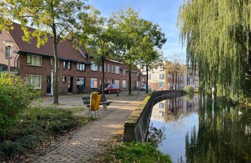 Alphen aan den Rijn House | Unique Urban Retreat with Modern Garden and Pool Access