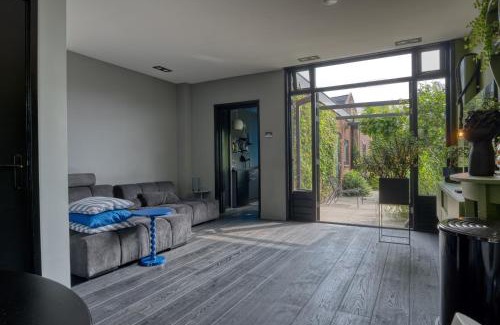 Alphen aan den Rijn House | Unique Urban Retreat with Modern Garden and Pool Access
