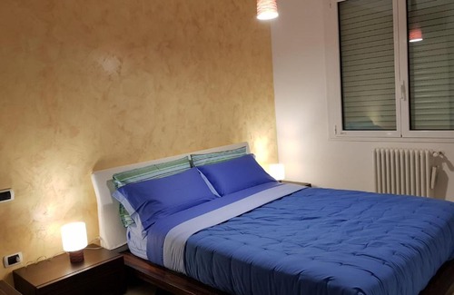 Granarolo dell'Emilia Apartment | Modern Black and White Apartment with Family-Friendly Amenities