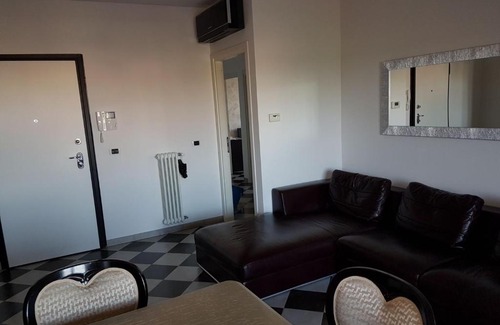 Granarolo dell'Emilia Apartment | Modern Black and White Apartment with Family-Friendly Amenities