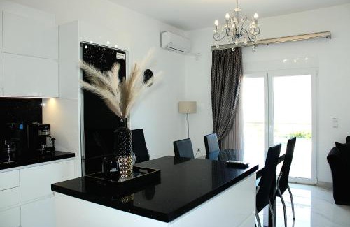 Korithion Apartment | Seaside Bliss at BLACK & WHITE House Kalamia - 4 Star Gem