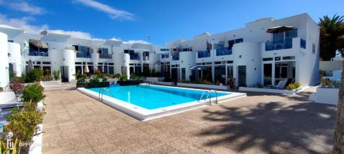 Puerto del Carmen Apartment | Tranquil BLU: Oceanfront Escape with Pool & 9.7/10 Rating