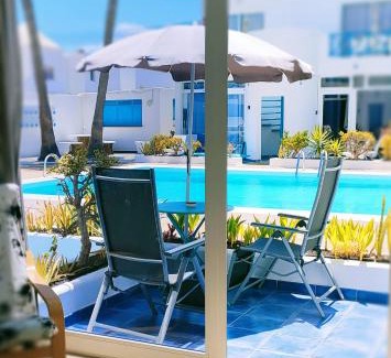 Puerto del Carmen Apartment | Tranquil BLU: Oceanfront Escape with Pool & 9.7/10 Rating
