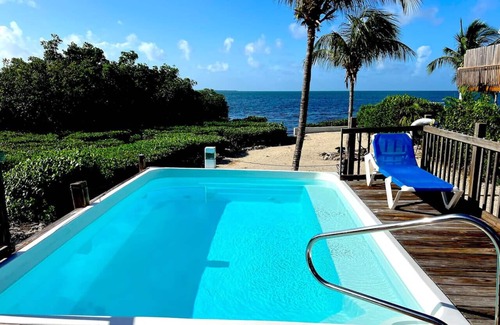 Cudjoe Key House | Beautiful Blue Vacation Home with Private Heated Pool