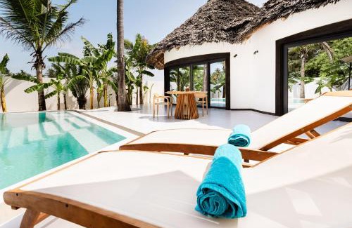 Jambiani Hotel | Escape to Blue Moon Resort: Oceanfront Paradise Awaits