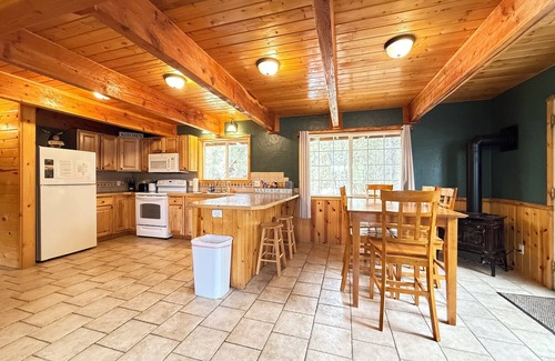Island Park Cabin | Cozy Blue Stone Escape: Perfect for Snowmobile Adventures