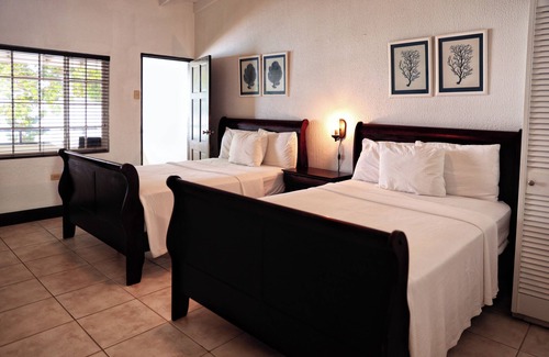 Speyside Hotel | Blue Waters Inn: Relax by the Pool with Ocean Views