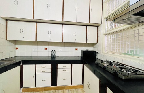 Sushant Lok Apartment | Experience BluO 1BHK with Pool, Kitchen & Balcony Bliss