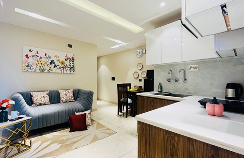 Sector 14 House | Cozy BluO 1BHK Suite with Balcony, Gym & Family Amenities