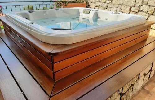 Magugnago Apartment | Indulge in Appartamento DELUXE 1 with Hot Tub & Lake Views
