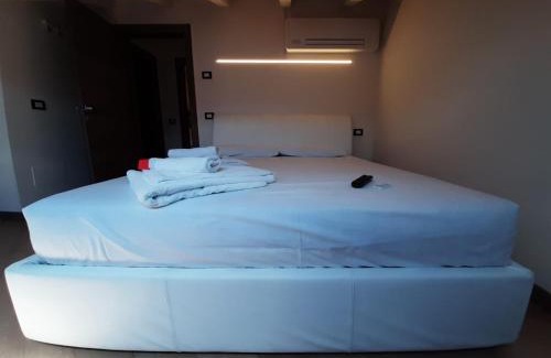 Magugnago Apartment | Indulge in Appartamento DELUXE 1 with Hot Tub & Lake Views