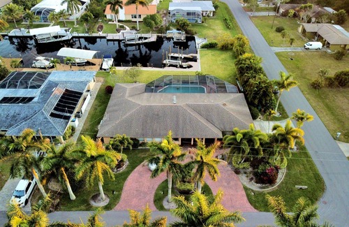 Pelican House | Boater's Dream: Poolside Retreat Near Open Water Awaits