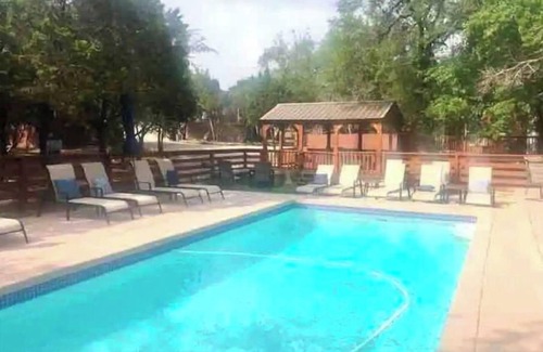 Austin Cabin | Discover Bobcat Cabin: Poolside Retreat in Tiny Home Resort