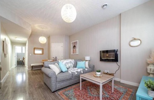 North Central Edmonton House | Boho Suite: Cozy Retreat with King Bed and Fireplace