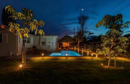 Boynton Beach House | Boho Tiki Villa w Heated Saltwater Pool, King Beds & 6TVs