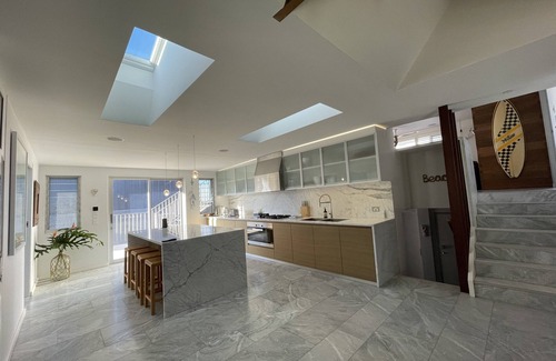 Culburra Beach House | Discover Bombora: Beach House with Oceanfront Pool & Spa