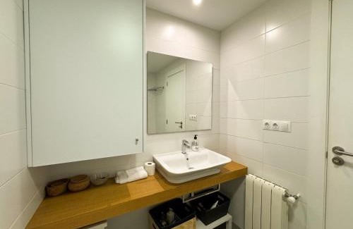 La Xerea Apartment | Elegant Hotel Retreat on Historic Street with Family Amenities