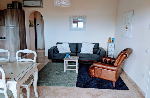 Porto Pozzo Apartment | Seaview Apartment with Private Garden & Pool Retreat