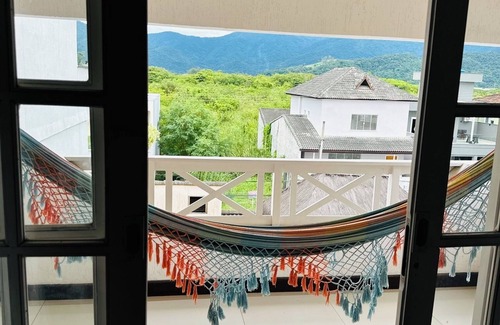 Vargem Grande Apartment | Master suite with balcony. Recess of the pioneers.