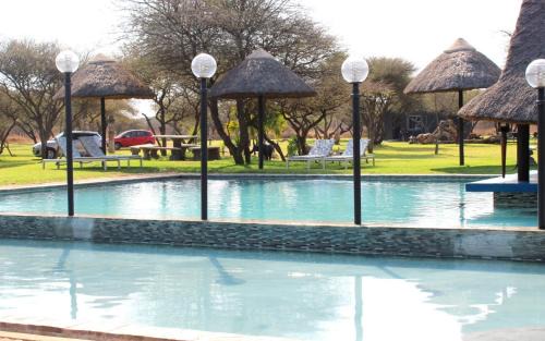 Polokwane Cabin | Discover Bradbury Game Lodge: Pool and Oceanfront Retreat