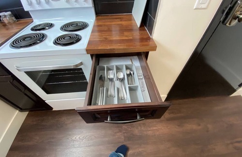 North Central Edmonton Apartment | Modern 1 Br Apartment Near Attractions with Breakfast Included