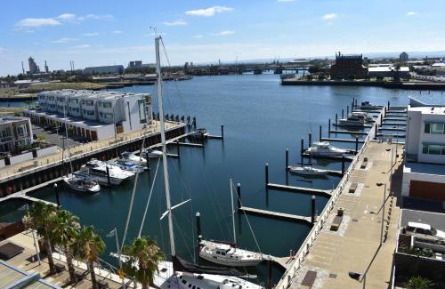 New Port Apartment | Relax at Breakwater Apartment: 4-Star Retreat with Spa