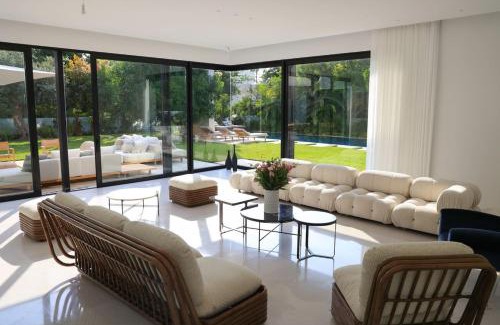 Herzliya Pituach Apartment | Elegant Villa with Pool & Sauna Steps from the Beach