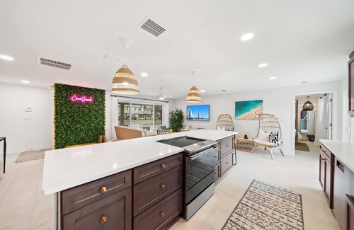 Venetian Way House | Bright Beachy Pool Home with Ocean Views & Spa Retreat