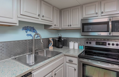 Villa Sabine Condo | Vibrant Beach-Themed Condo with Ocean View - Sand Dollar W107