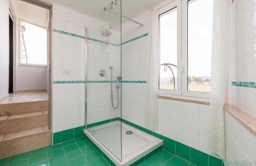 Vittorio Emanuele Apartment | Inviting Oceanfront Retreat at Bright Rooftop by Napoliapartments
