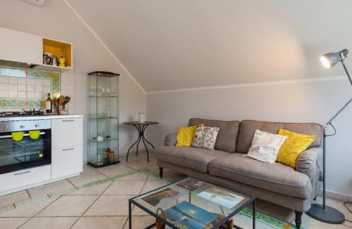 Vittorio Emanuele Apartment | Inviting Oceanfront Retreat at Bright Rooftop by Napoliapartments