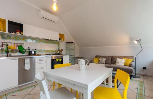 Vittorio Emanuele Apartment | Inviting Oceanfront Retreat at Bright Rooftop by Napoliapartments