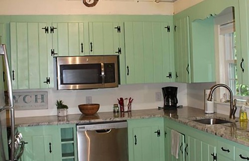 East Falmouth House | Bright Cape Cod Cottage with Ocean Views and Pool Access