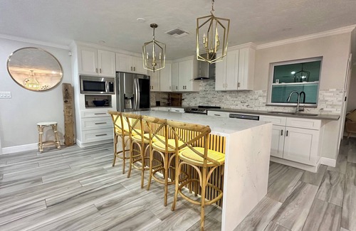 St. Petersburg House | Broadwater Gem: Poolside Retreat with Private Boat Dock
