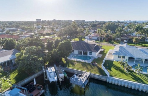 St. Petersburg House | Broadwater Gem: Poolside Retreat with Private Boat Dock