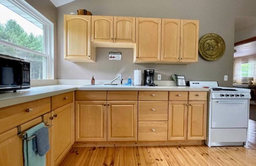 Grawn House | Brookside Cottages and Resort The Big House