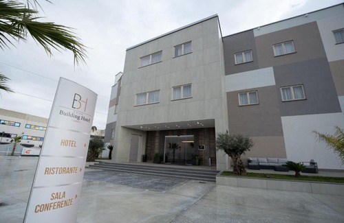 Carinaro Hotel | Discover Building Hotel: 4-Star Stay with Top Amenities