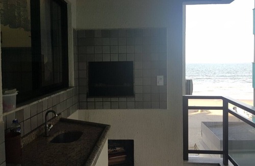 Itapema Apartment | Building in front of the sea, in the heart of half beach