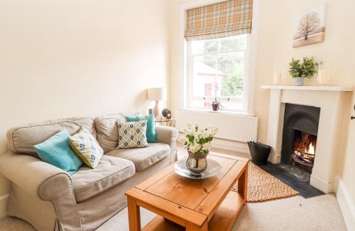 Wrexham Apartment | Discover Butler's Flat: 4-Star Retreat with Pool Access