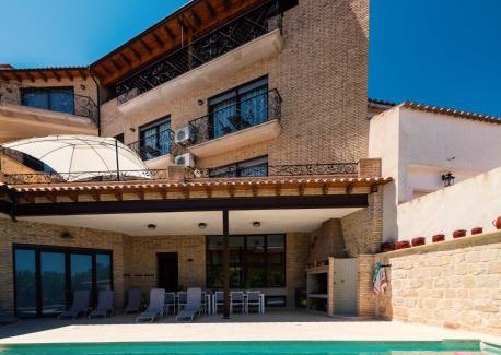 Calaceite Apartment | Ca l'Apotecari: Oceanfront Escape with Pool & 9.1 Review Score