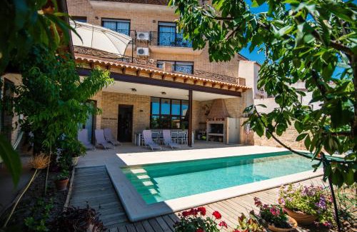 Calaceite Apartment | Ca l'Apotecari: Oceanfront Escape with Pool & 9.1 Review Score