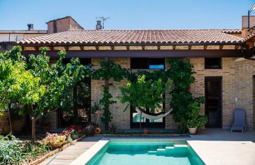 Calaceite Apartment | Ca l'Apotecari: Oceanfront Escape with Pool & 9.1 Review Score